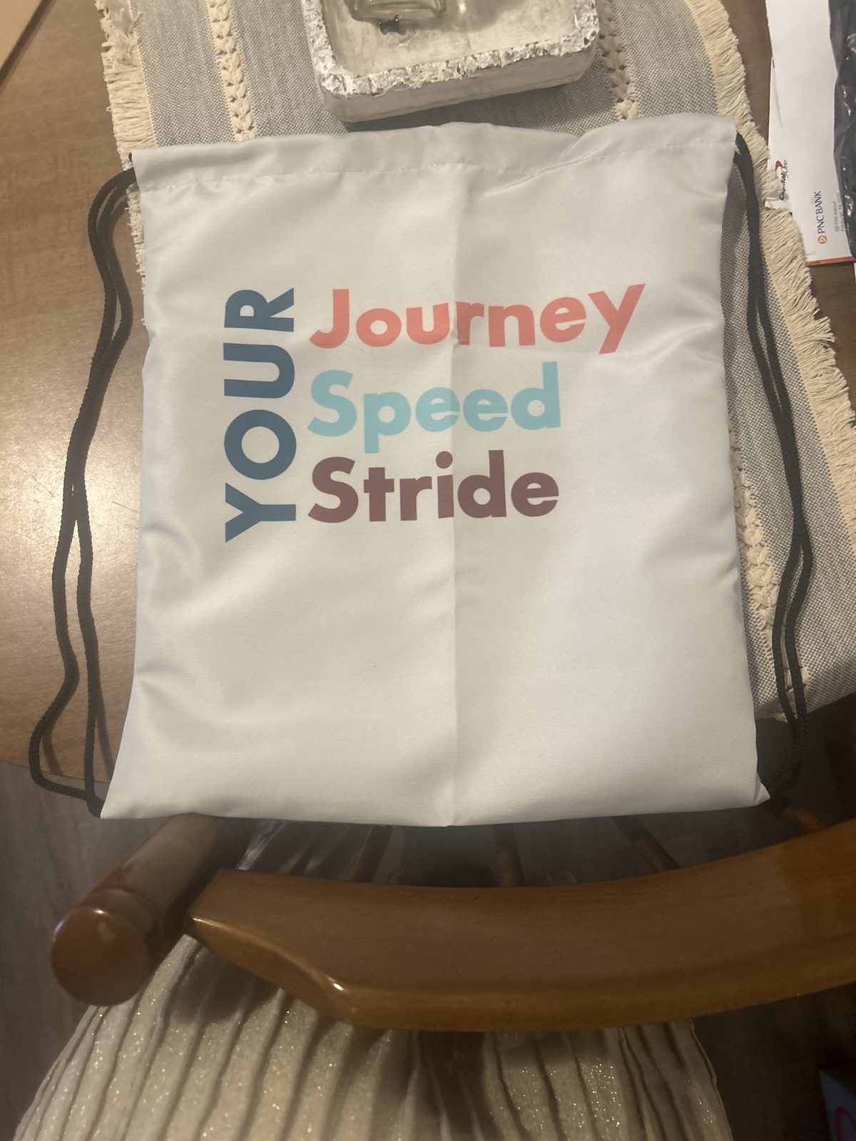 Stride branded drawstring bag with tagline